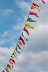 colorful flags against the blue sky