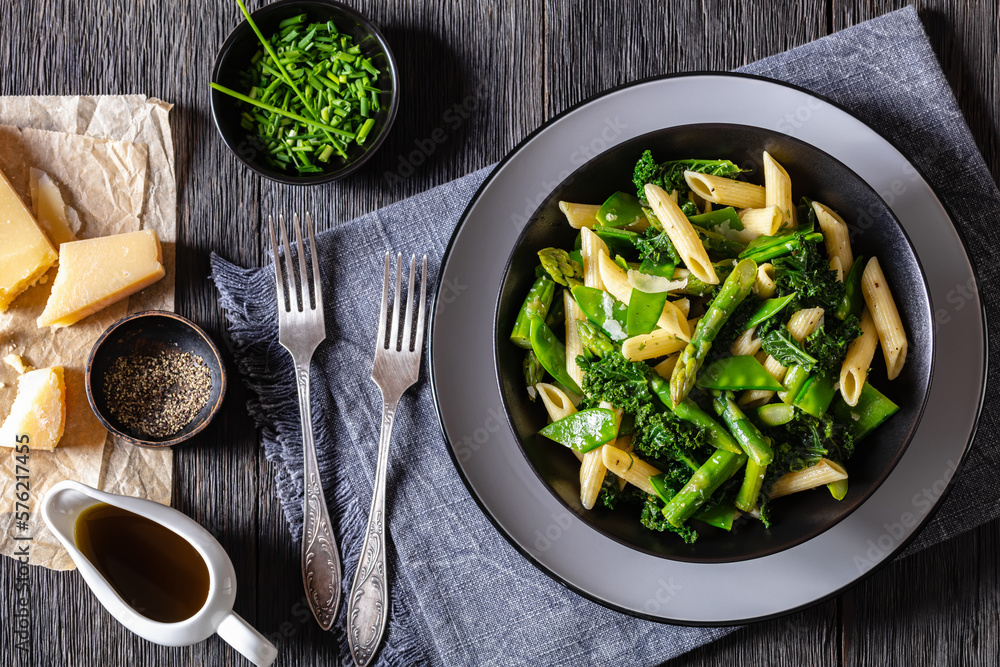 Poster pasta primavera with green veggies, cheese in bowl