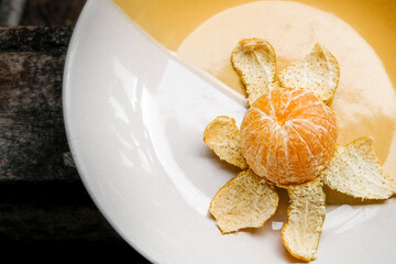peeled tangerine on a plate