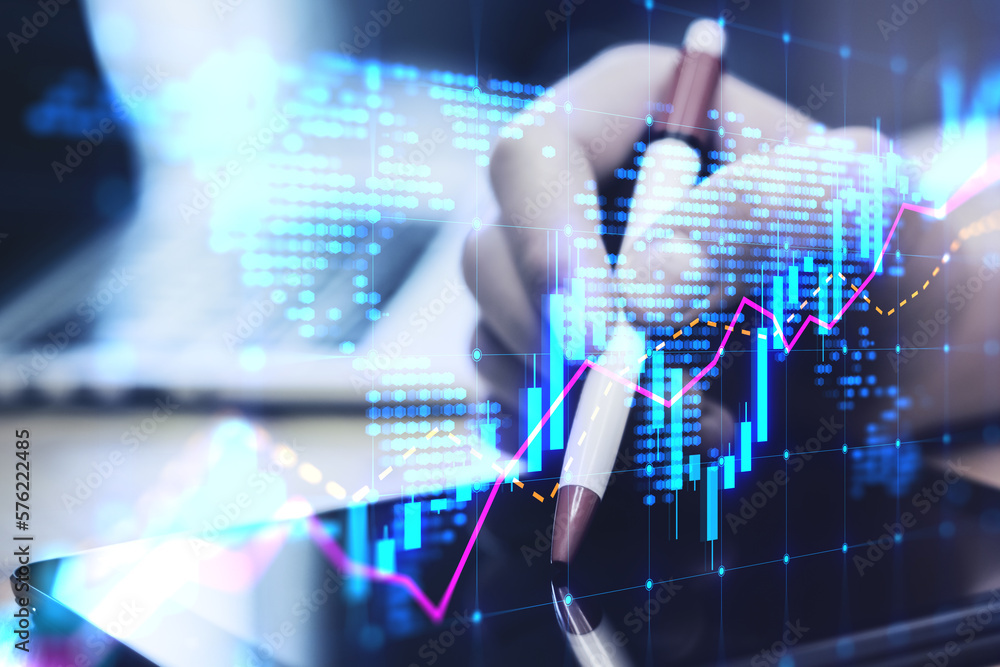 Poster close up of hands using digital pad on desktop with laptop and glowing candlestick forex chart map h
