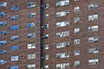 Fototapeta na wymiar Air conditioners on house facade in Manhattan