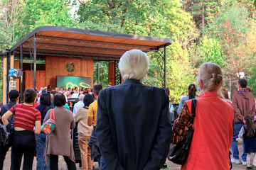 elderly people are watching a concert. a concert on the street