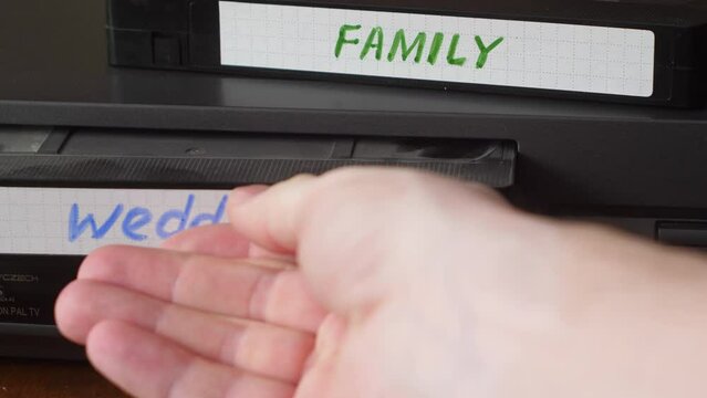 vintage video cassette with the inscription wedding, family on a video player.  home video archive viewer on video cassettes, 