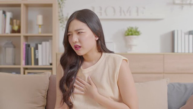 Woman have a heart attack in chest pain after wake up in the morning,Healthcare Concept