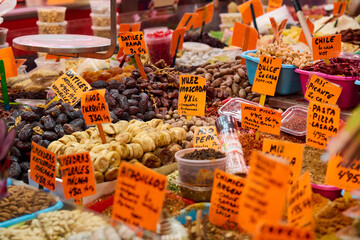 Assortment of nuts and dried fruits in market hall in Malaga, Spain