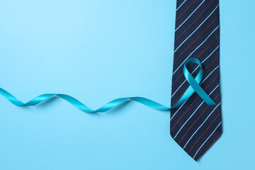 Blue ribbon symbolic for prostate cancer awareness campaign and men's health in November and September month
