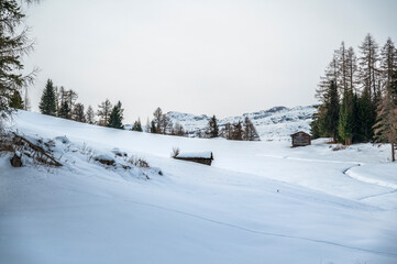 Fototapeta na wymiar Alta Val Badia in winter. The village of La Val surrounded by the Dolomites. 