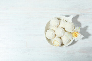 Concept of tasty sweets, coconut candies, space for text