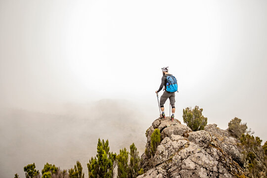 Hiker looking at view, Machame Route, Mount Kilimanjaro, Tanzania