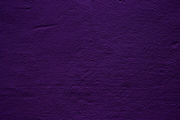 Purple colored abstract wall background with textures of different shades of violet