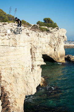 Mountain biker on coastal cliffs
