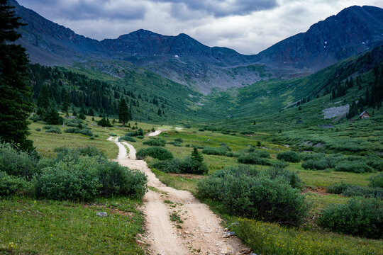 Backcountry mountain road through a valley in Colorado