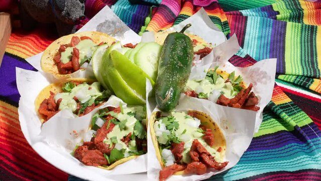 Plate of pulled pork street tacos, lime, chili pepper - food truck series