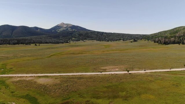 Aerial of adventure motorcycle riders in front of Hahns Peak in Steamboat Colorado in summer
