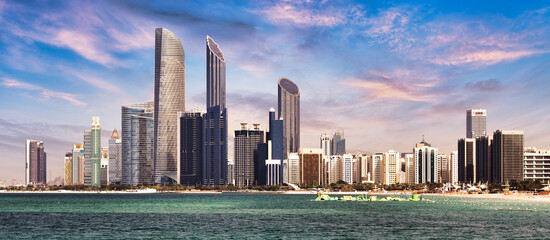 Abu Dhabi skyline with reflection in sea, United Arab Emirates - panorama - obrazy, fototapety, plakaty