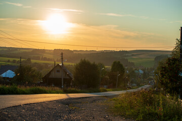 sunset in the village on a summer evening