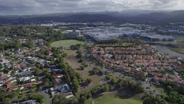 Bill Pippen Oval Near The Robina Town Centre And Neighborhood On Mudgeeraba Creek In Queensland, Australia. wide aerial