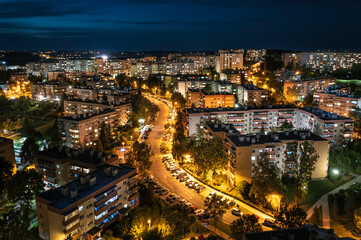 Long exposure of blocks of flats at night with traffic trails and lights - post soviet Krakow cityscape