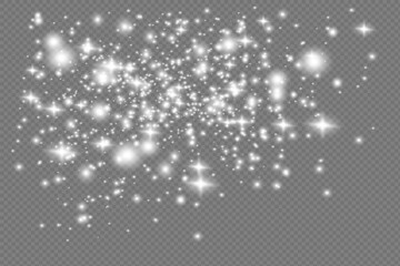 The dust sparks and golden stars shine with special light. Vector sparkles on a transparent background. Christmas light effect.