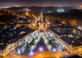 Aerial view of Podgórski Square with St. Joseph's Church in Krakow, Poland at night during...
