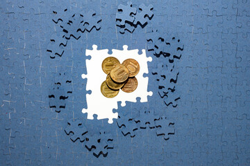 ruble coins hidden under puzzle pieces, frozen foreign exchange reserves, seized assets of...