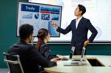 Millennial Asian professional successful male businessman presenter speaker lecturer in formal...
