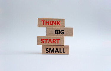 Think big start small symbol. Concept words Think big start small on wooden blocks. Beautiful white background. Business and Think big start small concept. Copy space