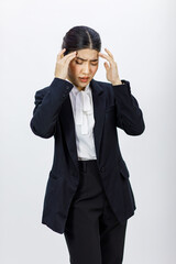 Portrait isolated cutout studio shot Millennial Asian professional successful female businesswoman in formal business suit holding hands on head having headache shouting on white background