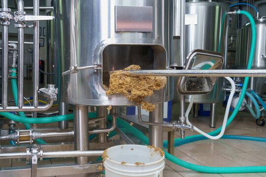 The process of cleaning up beer production waste at the brewery from beer brewing. Background