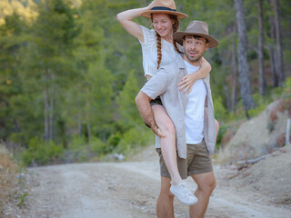 Young excited couple two friends family man woman in casual clothes boyfriend give piggyback ride...
