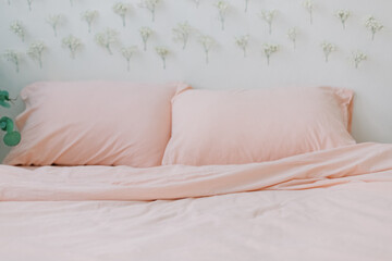 Fototapeta na wymiar pink linen bedding in loft room