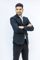 Portrait isolated studio shot  Asian Indian professional successful bearded male businessman entrepreneur ceo manager in formal business suit stand smiling crossed arms posing on white background