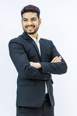 Portrait isolated studio shot  Asian Indian professional successful bearded male businessman entrepreneur ceo manager in formal business suit stand smiling crossed arms posing on white background