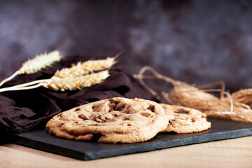 Freshly homemade chocolate cookies on a chalkboard