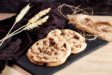 Freshly homemade chocolate cookies on a chalkboard