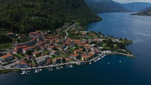 Picturesque houses by the lake d'orta. Cinematic aerial shot over the picturesque town of Pella, Novara, Piedmont, Italy. 