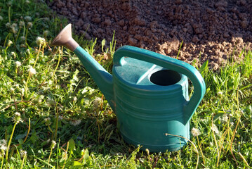 plastic watering cans in the village