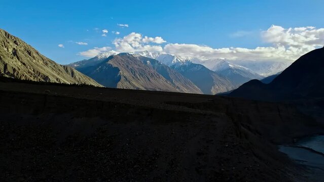 Drone rising over hills in Gilgit Baltistan region of Northern Pakistan