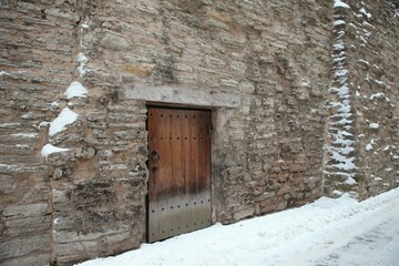 Fototapeta na wymiar Europe Old City historical house street church winter cold weather medieval door