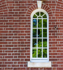 New arched window in a brick wall with keystone top center. With arched brick detail.  new custom...