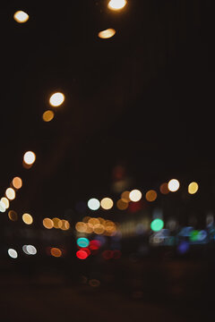 Colorful lights of urban city surrounding moving and blurred by motion. the light trails on the street. Blurred defocused lights of city traffic 