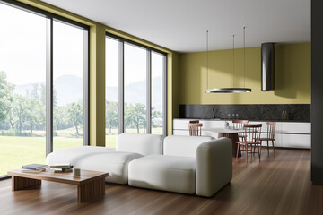 Panoramic yellow kitchen and living room interior