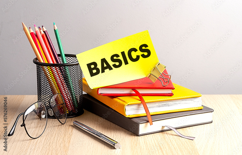 Poster basics written on a sticky on notebooks
