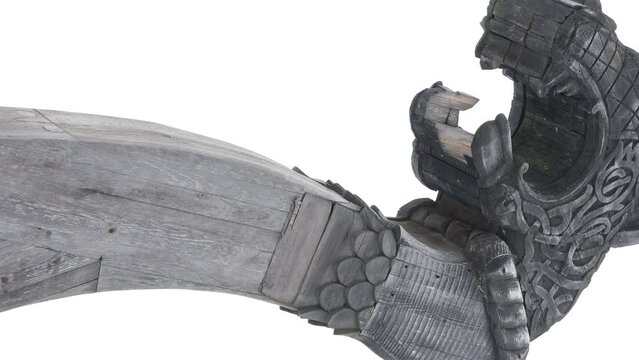 Prow of a Viking ship. Drakkar. Wooden figurine of a dragon on the bow of the ship