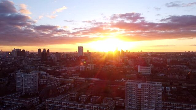 Wide establishing drone shot Hackney Borough in London at sunset