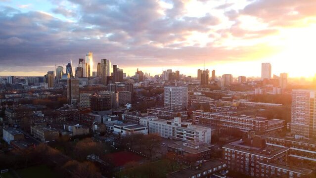 Aerial view intense orange yellow sunset over East London city skyline