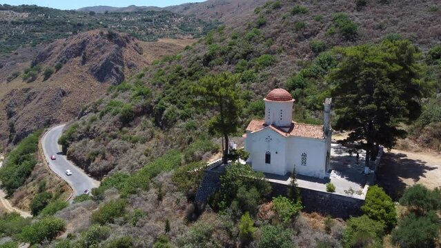Church of Agios Panton in Topolia village, Crete, overlooking Greek mountain valley, Aerial view