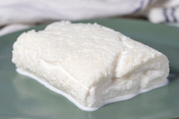 Clotted cream or butter cream. Turkish creamy dairy product. Cow's cream for breakfast. Local name kaymak. Close up