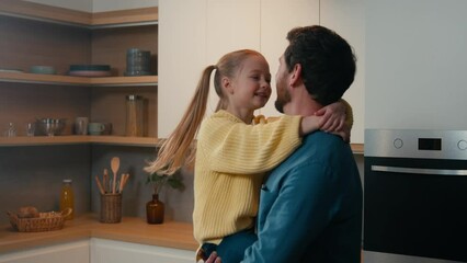 Adult man father holding spinning lovely daughter spin child around swirling kid in kitchen. Loving dad and little girl touch noses fooling enjoy bonding hugging embracing cuddling together at home - Powered by Adobe