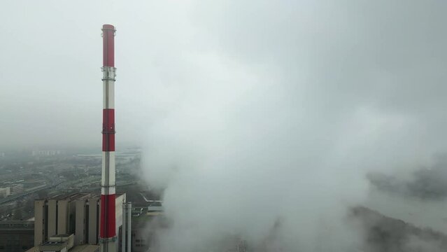 Energy extraction from coal, termal power station, view from height of the pipes in the fog, environmental issues, aerial view.